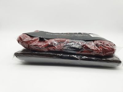 two bags of red meat sitting on top of each other