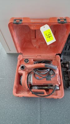 a tool in a case that is sitting on the floor