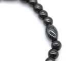 a picture of a black beaded necklace with a silver clasp