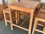 a small table and two chairs in a room