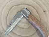 a knife that is sitting in a bowl on a table