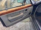 a car door with a window open on a snowy day