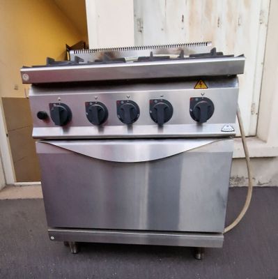 an image of a stove with four burners on it