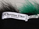 a label that says christian dior boutique on a black hat