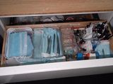a drawer that has a lot of items inside of it