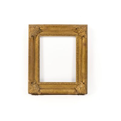 an old gold picture frame on a white wall with a white background