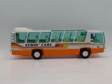 a toy bus that is sitting on a white surface