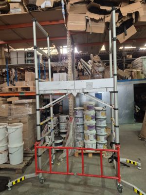 a picture of a warehouse with a lot of boxes and pallets
