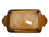 a picture of a gold plate with a label on it