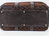 leather and canvas travel bag on a white background