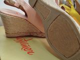 a pair of shoes that are on top of a box
