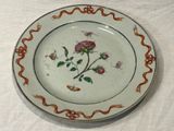 a white plate with a floral design on it