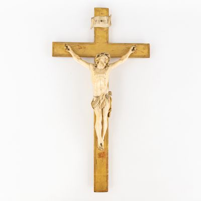 a wooden crucif with jesus on the cross on a white background