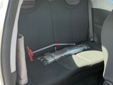 the back seat of a car with a bunch of items in it
