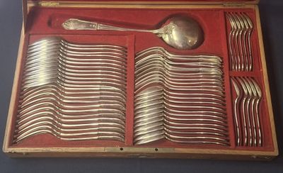a wooden box with silverware in it on a table