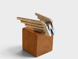 a wooden block with a bunch of keys in it