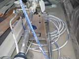 a truck that has a bunch of hoses in it