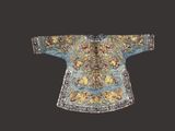 an image of a blue and gold embroidered shirt with flowers on it
