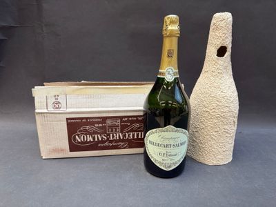 a bottle of wine sitting next to a bottle of wine