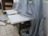 an image of a room that has a table and a chair in it