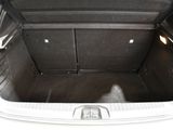 a trunk of a car with a seat folded open