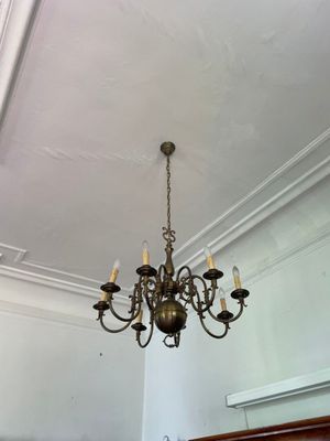 a chandelier hanging from the ceiling in a room