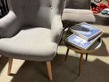 a chair and a table in a room with a lot of furniture