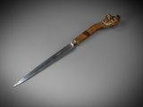 a close up of a knife with a wooden handle on a table