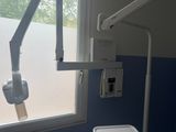 an image of a dentist ' s room with a window