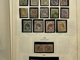 an open book with a bunch of different stamps on it