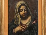une peinture à l'huile représentant une femme portant un voile sur la tête