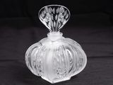 crystal glass perfume bottle on a black background photo
