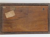 a picture of a wooden box with a piece of paper on it
