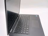 a laptop that is open on a white surface