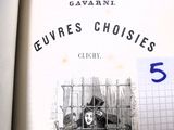 un livre sur lequel figure la photo d'une femme dans une cage