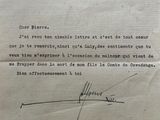an old letter with a crown on it sitting on top of a piece of paper