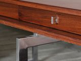 a wooden table with a metal frame on it