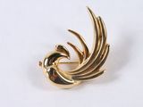 an image of a gold plated brooch with a bird on it