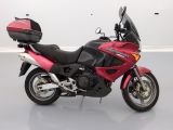 a picture of a red motorcycle parked in a room