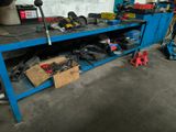 a blue workbench with tools on it in a garage