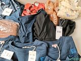 a pile of clothing that is sitting on a table