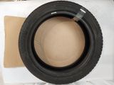 a tire that is sitting on top of a cardboard box