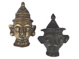 pair of antique brass figurines of a man and a woman ' s head