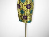 a mannequin with a yellow and blue skirt on a stand