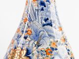 a vase with a blue and orange floral design on it