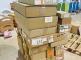 many boxes stacked on top of each other in a room