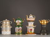several different types of vases are lined up on a table