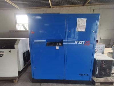 a close up of a machine in a warehouse with other machines