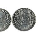two silver coins with a woman ' s face and a man ' s face on them