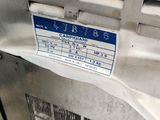 an air conditioner that has a sign on the side of it